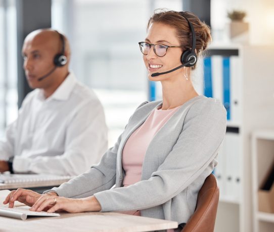 Call center, contact us and worker with a computer for support, help and consulting on the internet.